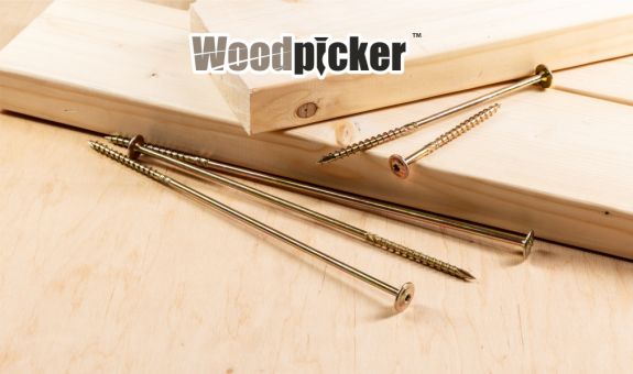 carpentry screws arranged on a wooden board and timber beams